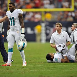 Aug 17, 2013; Houston, TX, USA; Miami Dolphins wide receiver Mike Wallace (11) reacts to the injury to tight end Dustin Keller (81) during the first half against the Houston Texans at Reliant Stadium.