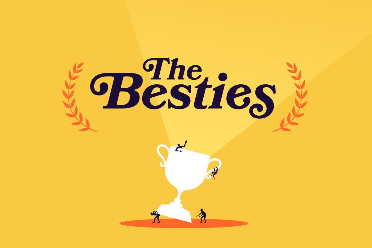 An illustration of a white trophy with four black figures. One is lifting the bottom of the trophy, another is waving from the top, another is climbing the handle, and the last figure is standing next to it with its arms outstretched. The background is gold. There is a light yellow light shining out from the trophy. Above it says, “The Besties” in black serif font with an orange laurel on either side.