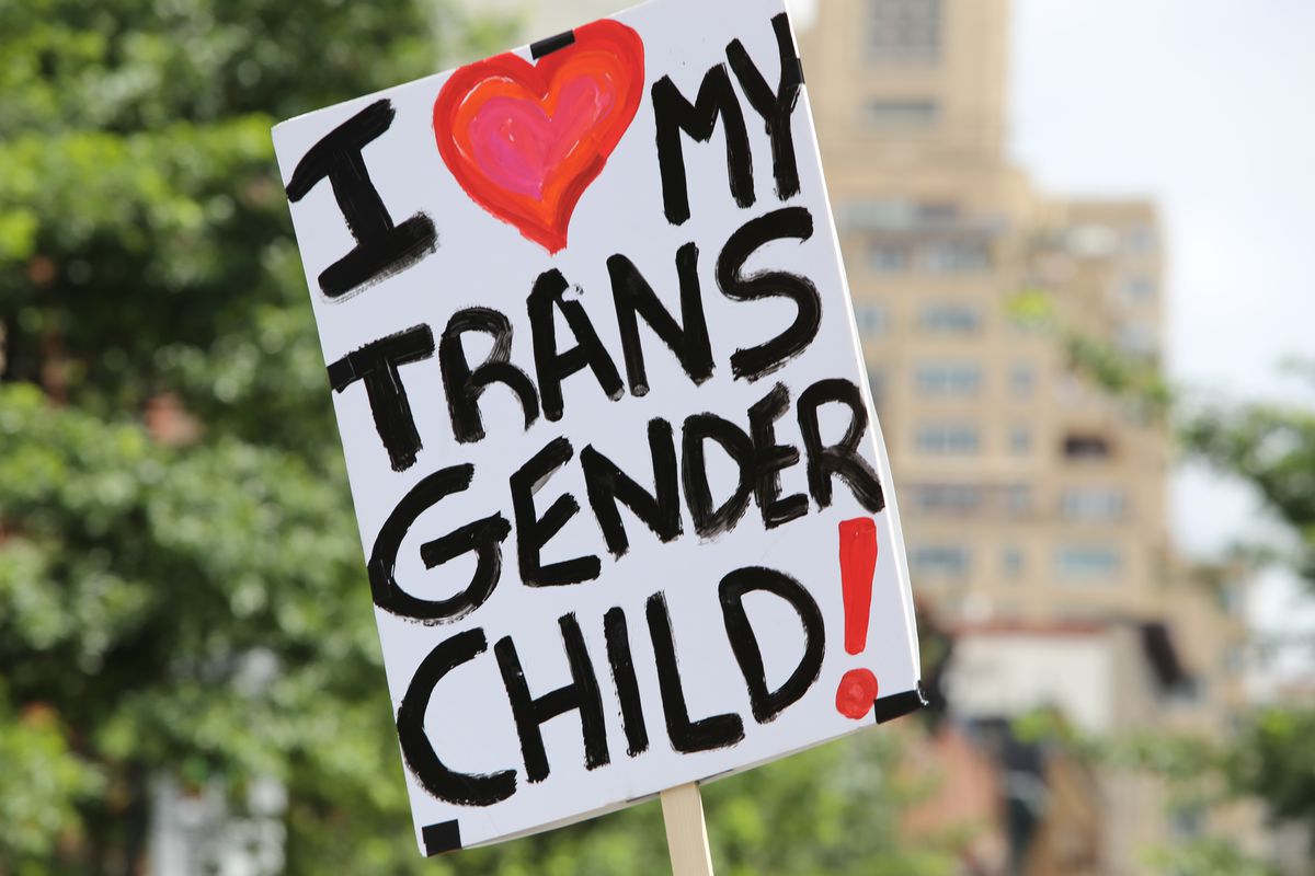A sign reads, “I love my transgender child!”