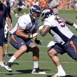 Broncos T Kyle Roberts (66) works on outside rush blocking against C Dillon Day (55).