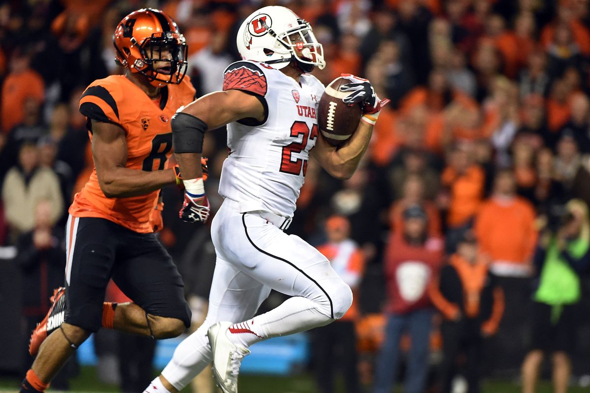 Utah running back Devontae Booker (23) scored the go-ahead touchdown in regulation, and a touchdown in each of the overtimes to will Utah to the victory over Oregon State in Corvallis, Ore.