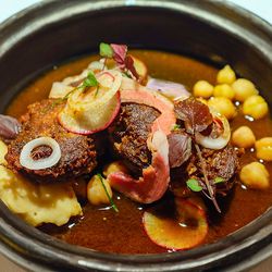 <a href="http://www.eater.com/2014/9/9/6158741/rick-bayless-frontera-grill-topolobampo-face-off">Topolobampo in Chicago: goat barbacoa.</a>