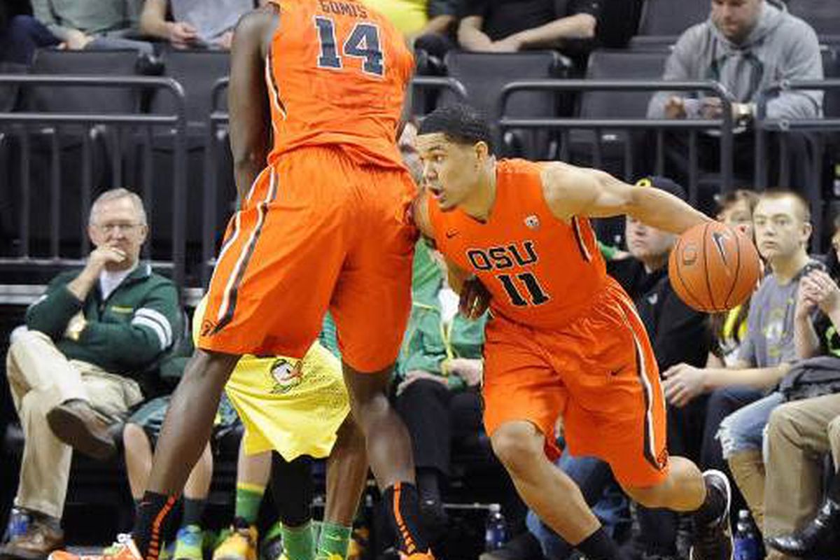Malcolm Duvivier drives around a screen set by Daniel Gomis in Oregon St.'s last visit to Matthew Knight Arena.