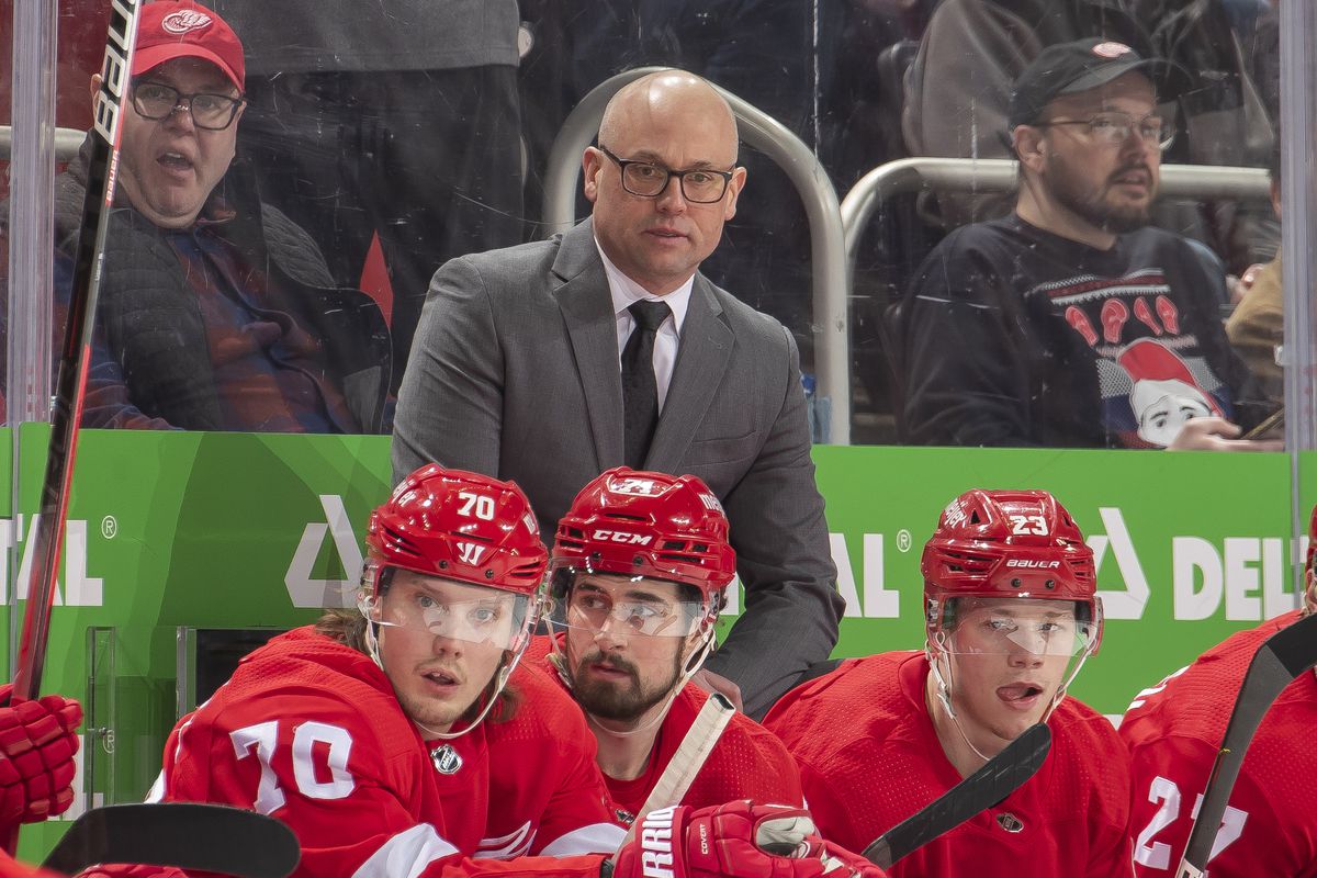 Head coach Jeff Blashill of the Detroit Red Wings looks on from the bench during the first period of an NHL game against the Boston Bruins at Little Caesars Arena on April 5, 2022 in Detroit, Michigan.