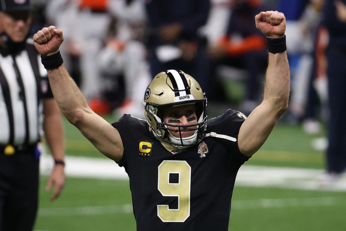 Drew Brees #9 of the New Orleans Saints celebrates a touchdown scored by Alvin Kamara #41 (not pictured) against the Chicago Bears during the fourth quarter in the NFC Wild Card Playoff game at Mercedes Benz Superdome on January 10, 2021 in New Orleans, Louisiana.