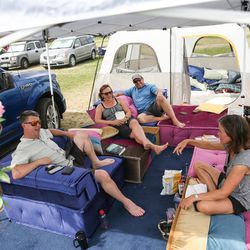 Scott Hall, Lisa Hotchkiss, Michael Rossi and Alison Griffin, all of California's Bay Area, hang out in their camp where they plan to watch the total solar eclipse in a field behind Weiser High School in Weiser, Idaho, on Sunday, Aug. 20, 2017.