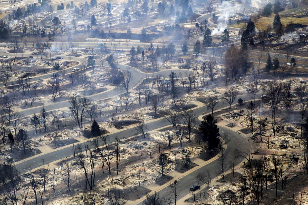 A view of a Boulder County neighborhood that was destroyed by a wildfire is seen from a Colorado National Guard helicopter during a flyover by Gov. Jared Polis on Friday, Dec. 31, 2021. 