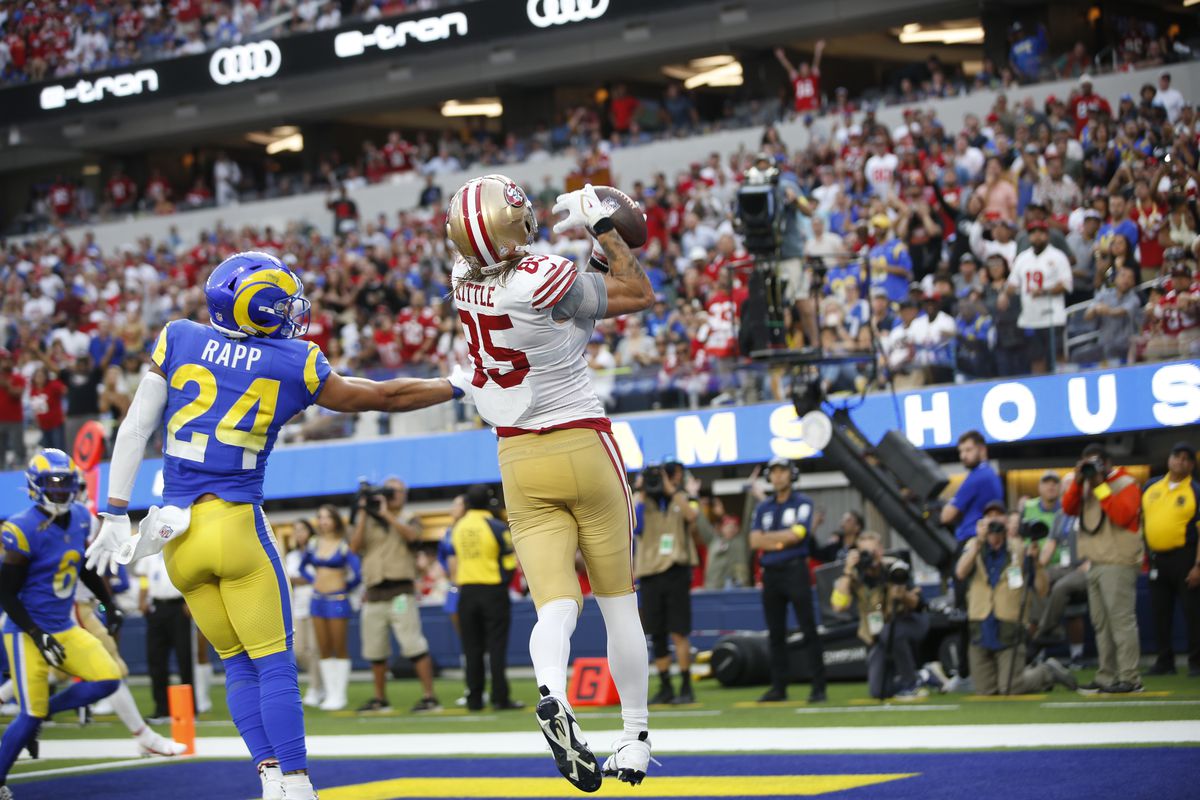 George Kittle #85 of the San Francisco 49ers makes a 7-yard touchdown catch during the game against the Los Angeles Rams at SoFi Stadium on October 30, 2022 in Inglewood, California.