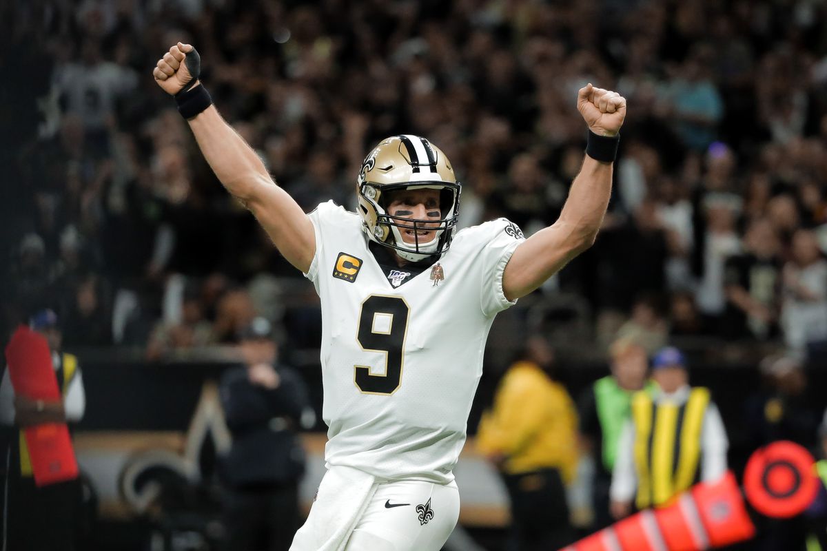 New Orleans Saints quarterback Drew Brees celebrates after a touchdown run by running back Alvin Kamara during the second quarter against the Minnesota Vikings of a NFC Wild Card playoff football game at the Mercedes-Benz Superdome.