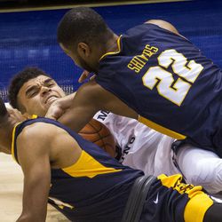 Brigham Young guard Elijah Bryant (3) gains possession of the ball before Coppin State guard Keith Shivers (22) can get to it during an NCAA college basketball game in Provo on Thursday, Nov. 17, 2016.