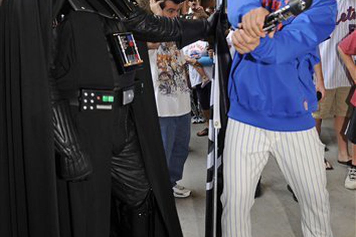 I (thankfully) couldn't find any pictures of the Mets bunting, so this strange shot of Ryota Igarashi in the ultimate mismatch against Darth Vader will have to do.