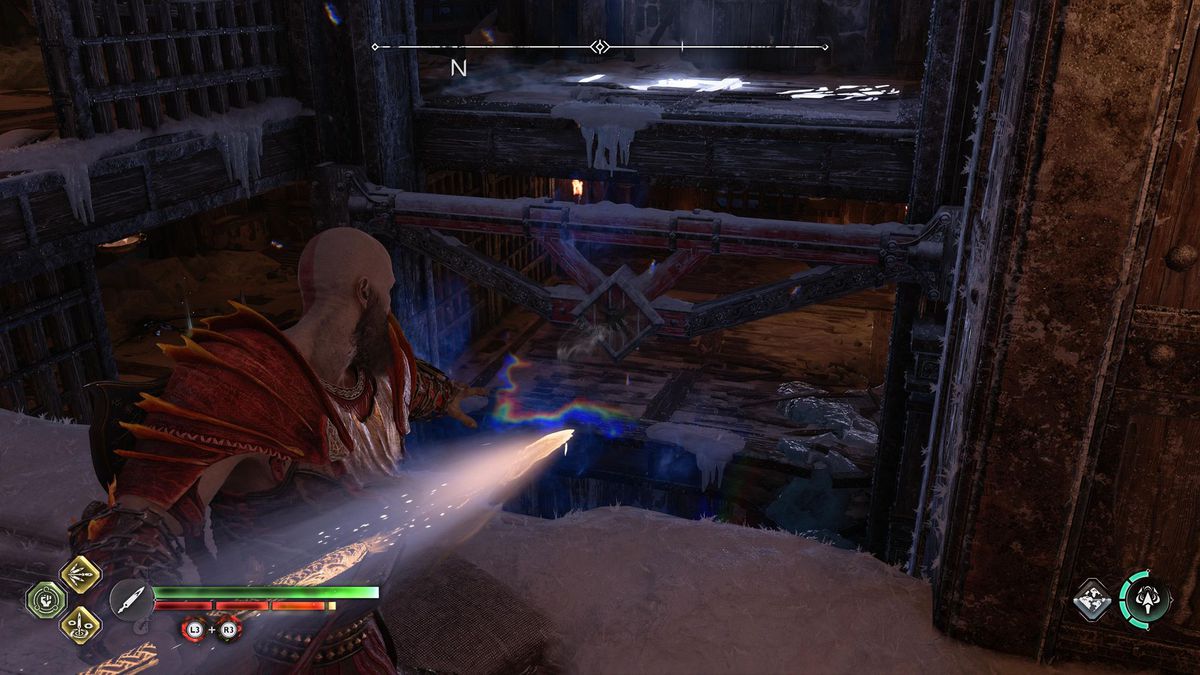 Kratos throws a spear at a crack in the wall in Niflheim prison in God of War Ragnarok.