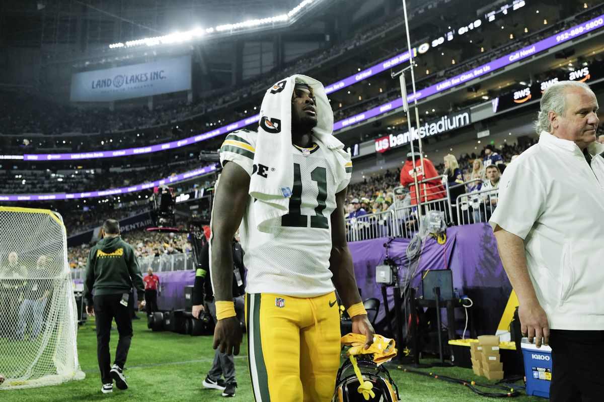 Jayden Reed #11 of the Green Bay Packers walks along the sideline in the third quarter of the game against the Minnesota Vikings at U.S. Bank Stadium on December 31, 2023 in Minneapolis, Minnesota.
