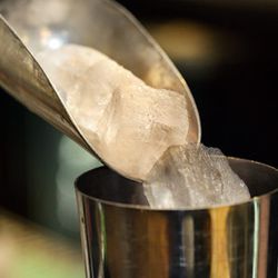 Five pieces of cold-pressed ice go into the tumbler.