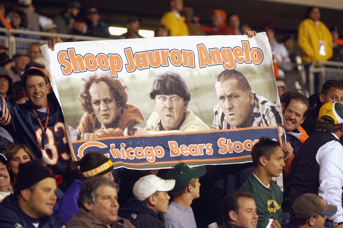 Fans of the Bears hold up a Three Stooges sign