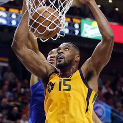Utah Jazz forward Derrick Favors dunks the ball with LA Clippers forward Wesley Johnson defending during NBA action in Salt Lake City on Saturday, Jan. 20, 2018.