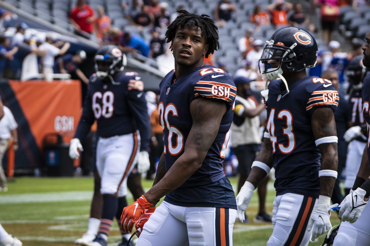 Bears safety Deon Bush and his teammates walk off the field Saturday.