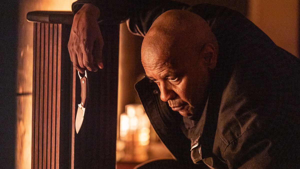 Denzel Washington as Robert McCall holding a knife in The Equalizer 3.