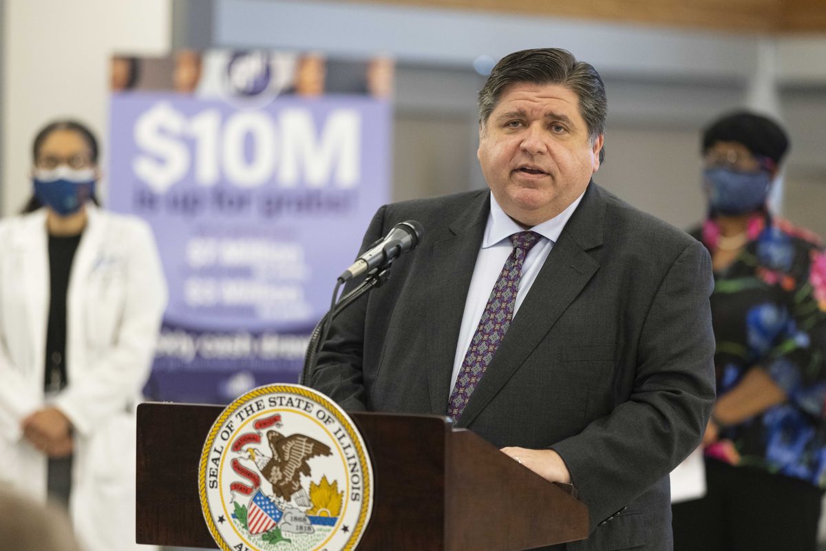 Gov J.B. Pritzker announces the COVID-19 vaccine lottery program in the Back of the Yards neighborhood in June.