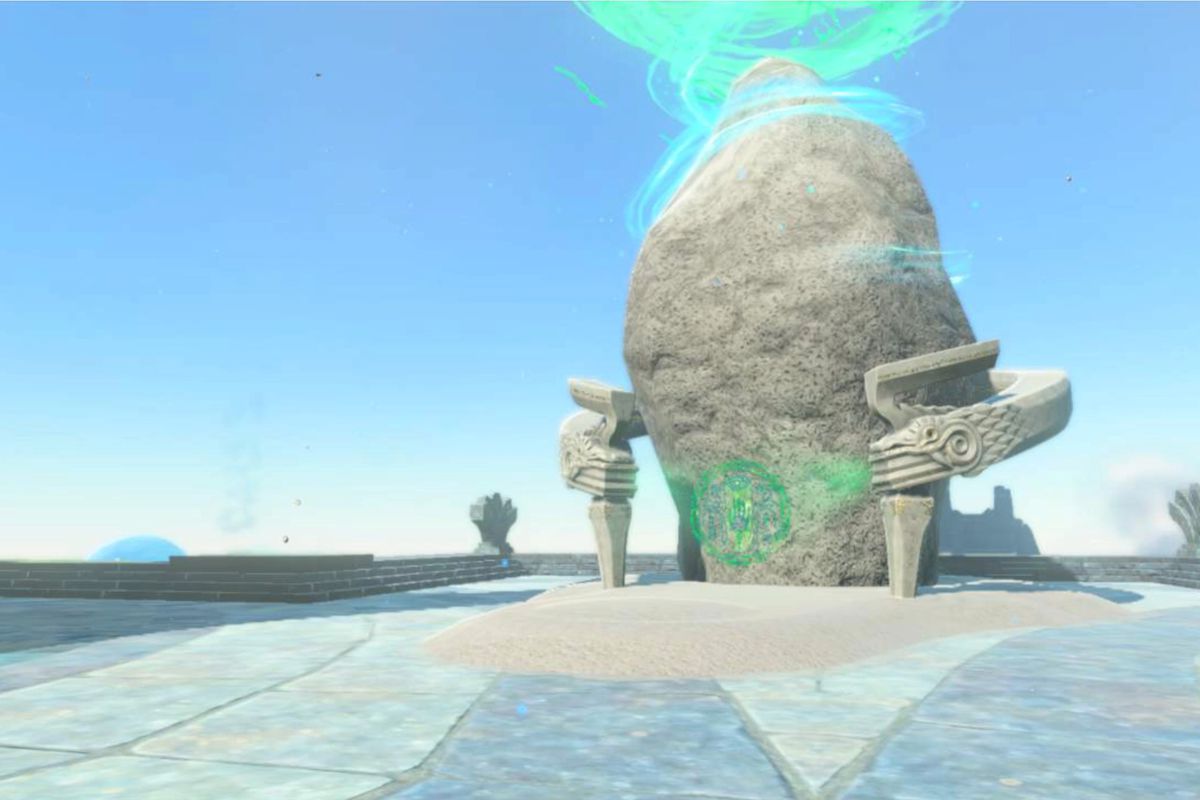 The rounded stone exterior with gray wings marking the entrance to a shrine. A blue field of sky is behind it, as it’s on a sky island.