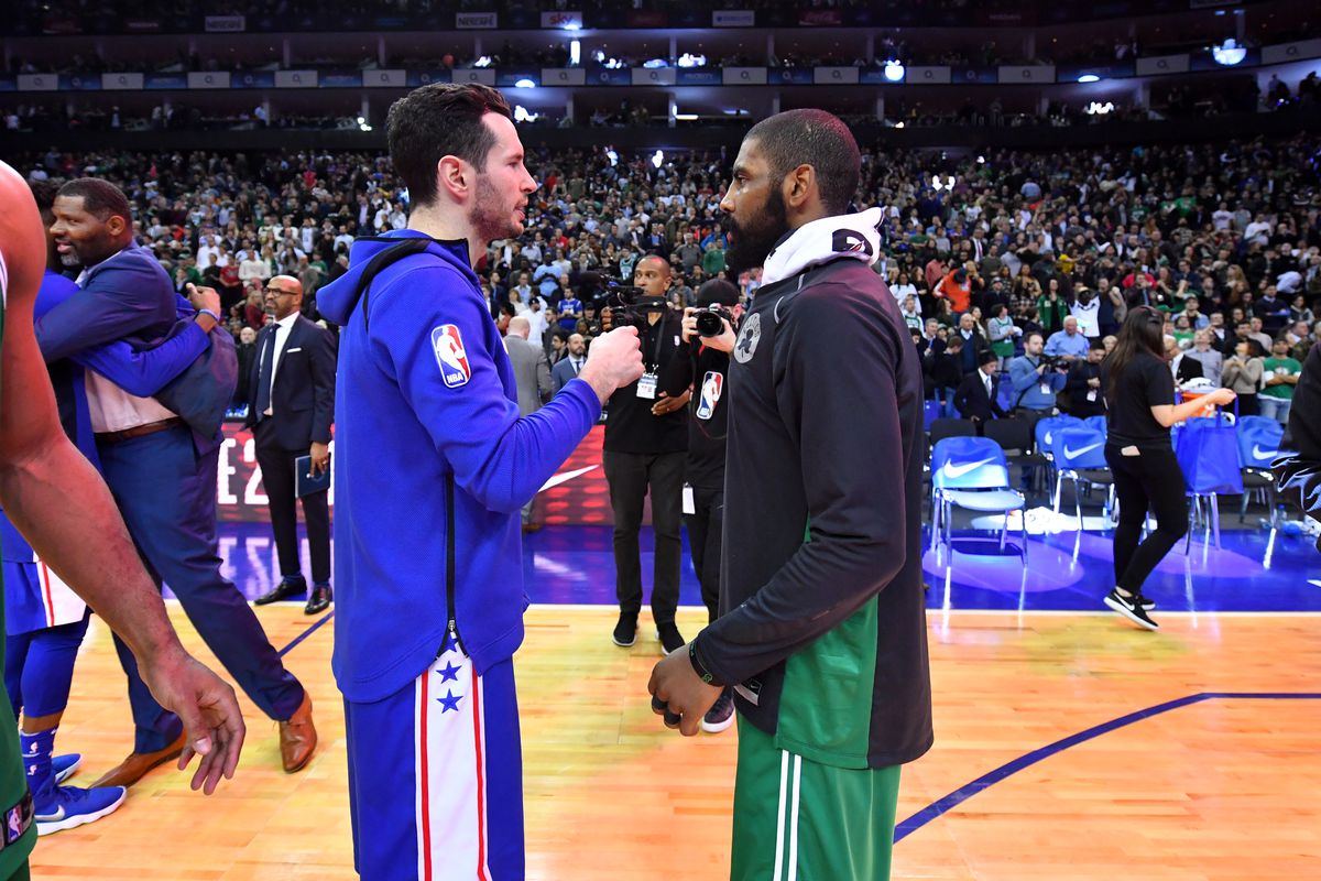 J.J. Redick and Kyrie Irving shake hands on the court