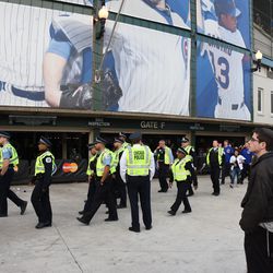 5:12 p.m.  Police returning from their dinner break, to take up positions in front of the ballpark - 