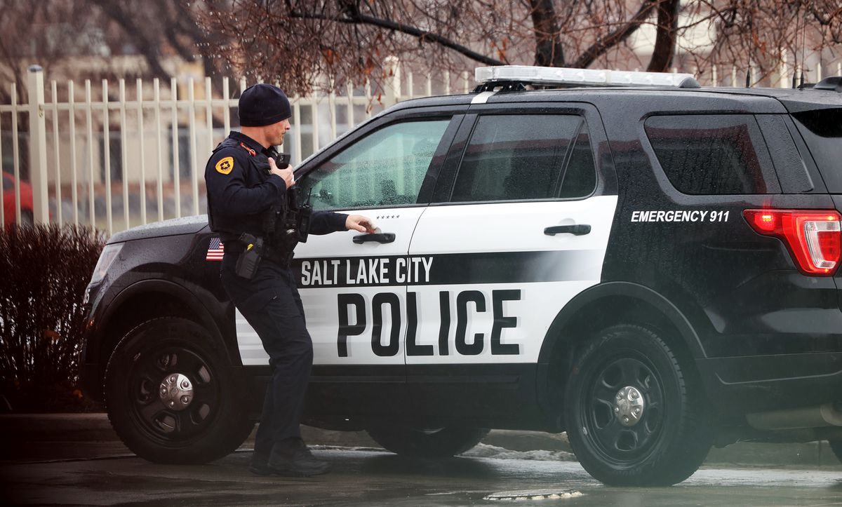 A Salt Lake City police officer works at the scene of a collision on Redwood Road and 700 North in on Wednesday, Jan. 5, 2022..