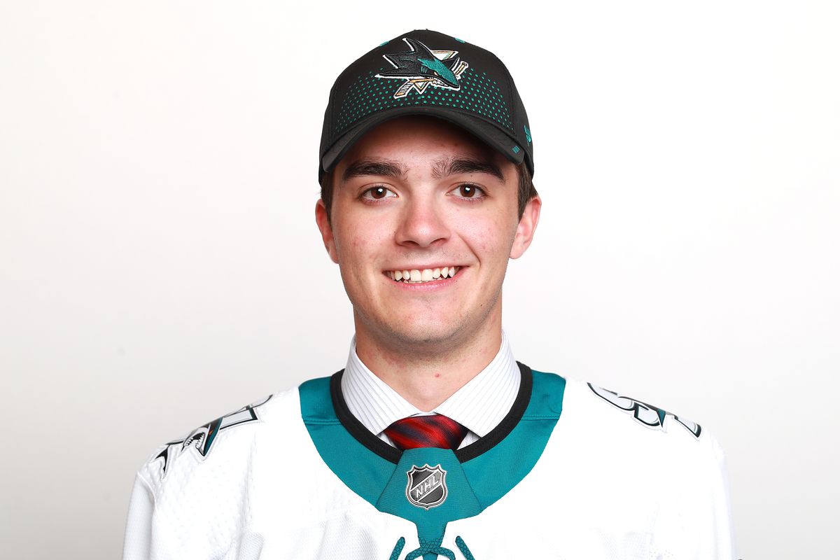 DALLAS, TX - JUNE 22: Ryan Merkley poses after being selected twenty-first overall by the San Jose Sharks during the first round of the 2018 NHL Draft at American Airlines Center on June 22, 2018 in Dallas, Texas.