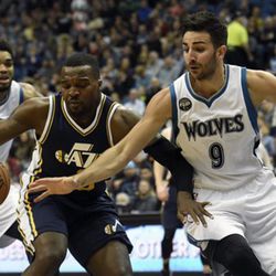 Minnesota Timberwolves’ Ricky Rubio (9), of Spain, guards against Utah Jazz’s Shelvin Mack (8) during the first quarter of an NBA basketball game on Saturday, March 26, 2016, in Minneapolis. The Jazz won 93-84. (AP Photo/Hannah Foslien)