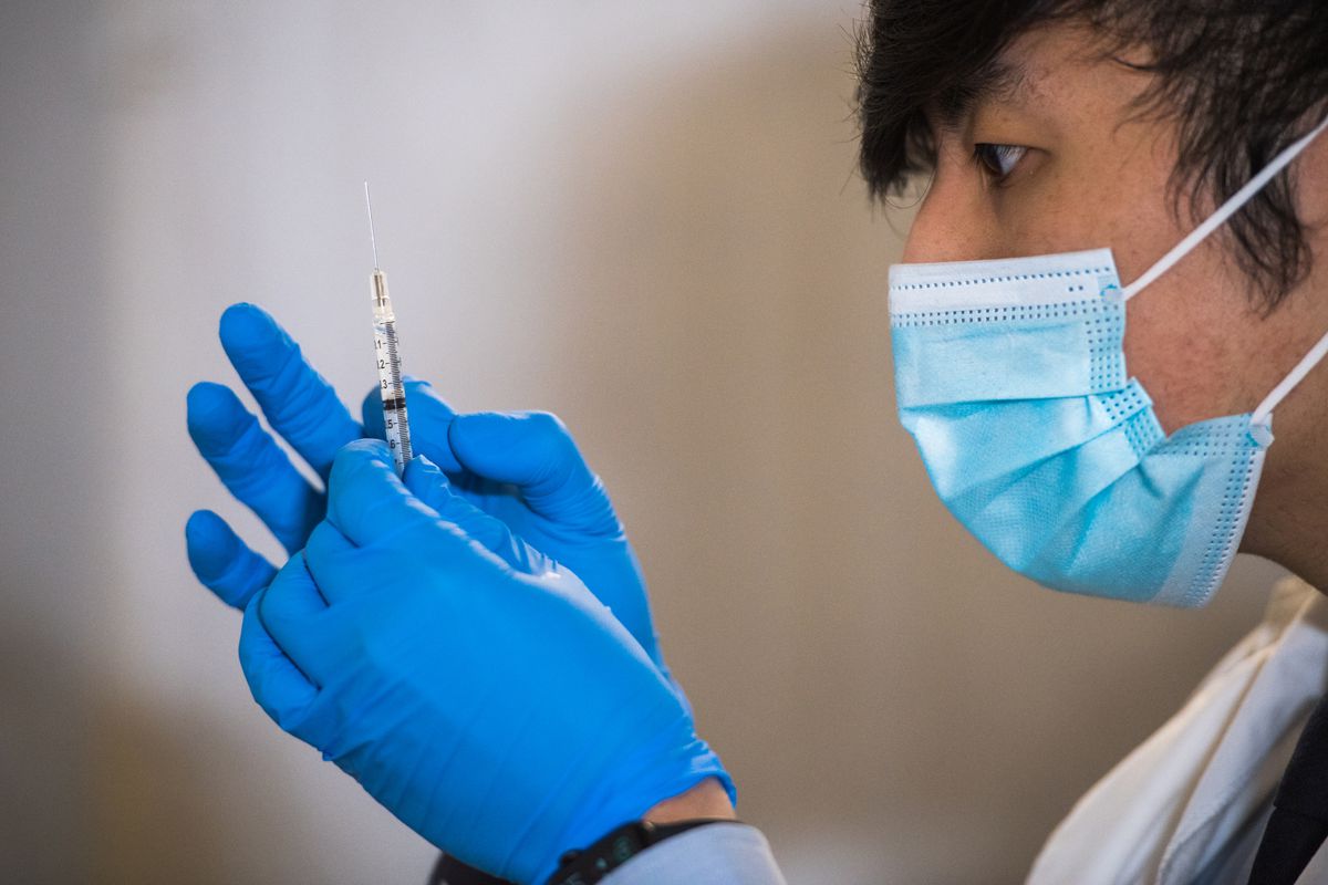 A healthcare worker prepares to deliver a coronavirus vaccine shot in East Harlem, Jan. 15, 2021.