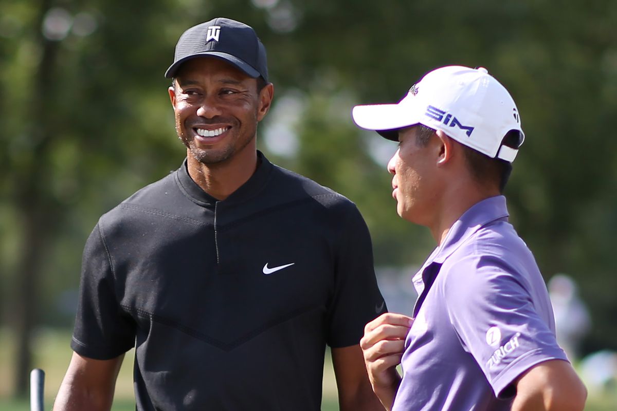 Tiger Woods and Collin Morikawa wait on the eighth tee during the third round of the BMW Championship golf tournament at Olympia Fields Country Club - North.