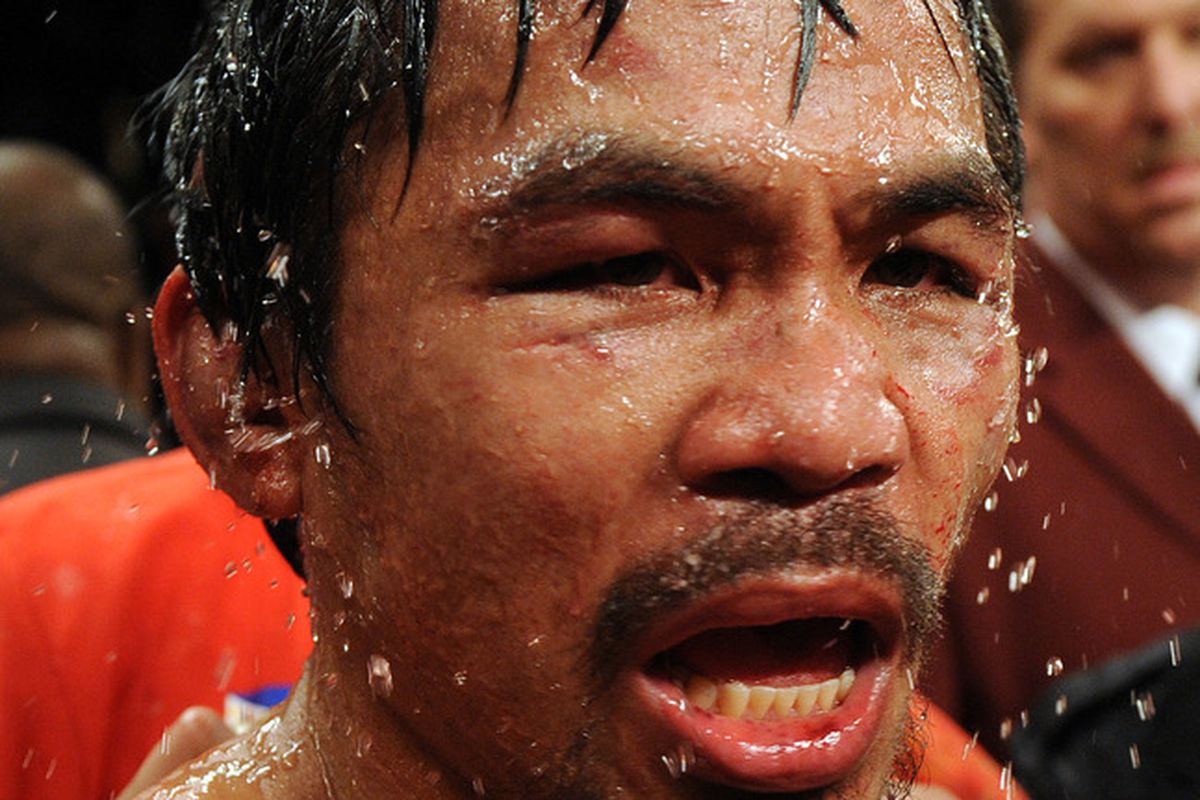 Despite a dominant win over Miguel Cotto on Saturday, Manny Pacquiao didn't walk away unscathed. The Filipino icon suffered ruptured cartilage in his ear. (Photo by GABRIEL BOUYS/AFP/Getty Images)