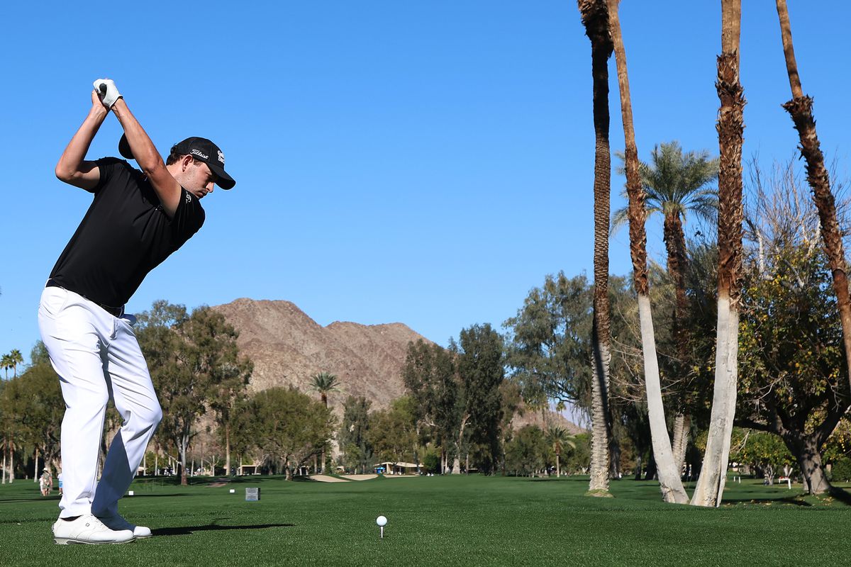 Patrick Cantlay plays a shot on the fifth hole during the first round of The American Express at the La Quinta Country Club on January 20, 2022 in La Quinta, California.