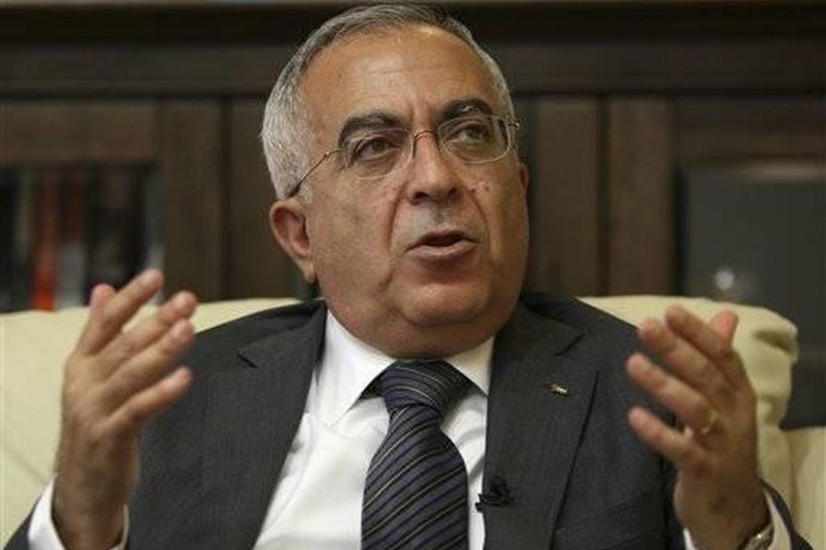 In this Tuesday, June 28, 2011 file photo, Palestinian Prime Minister Salaam Fayyad speaks during an interview with The Associated Press in the West Bank city of Ramallah. Palestinian officials say Fayyad has officially submitted his resignation, and is w