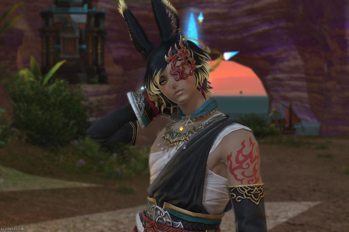 A male Viera in monk artifact gear stands in from of an Aetheryte