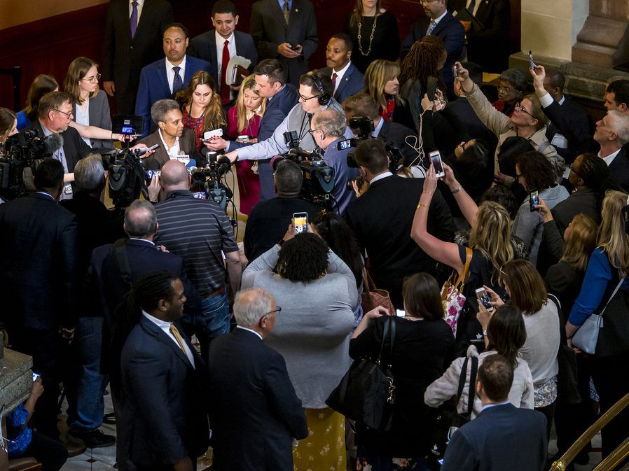 Mayor-elect Lori Lightfoot answers questions from the media as members of the public take photos with their cellphones in the rotunda at the Illinois State Capitol. (Justin L. Fowler/The State Journal-Register via AP)