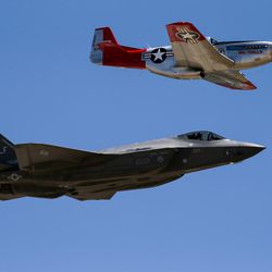 FILE: An F-35 Lightning II, bottom, and a P-51 Mustang fly in formation during the Warriors Over the Wasatch Open House and Air Show at Hill Air Force Base on Saturday, June 25, 2016.