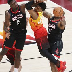Utah Jazz guard Donovan Mitchell (45) is defended by Houston Rockets center Clint Capela (15) during the NBA playoffs in Salt Lake City on Saturday, April 20, 2019. The Jazz lost 104-101.