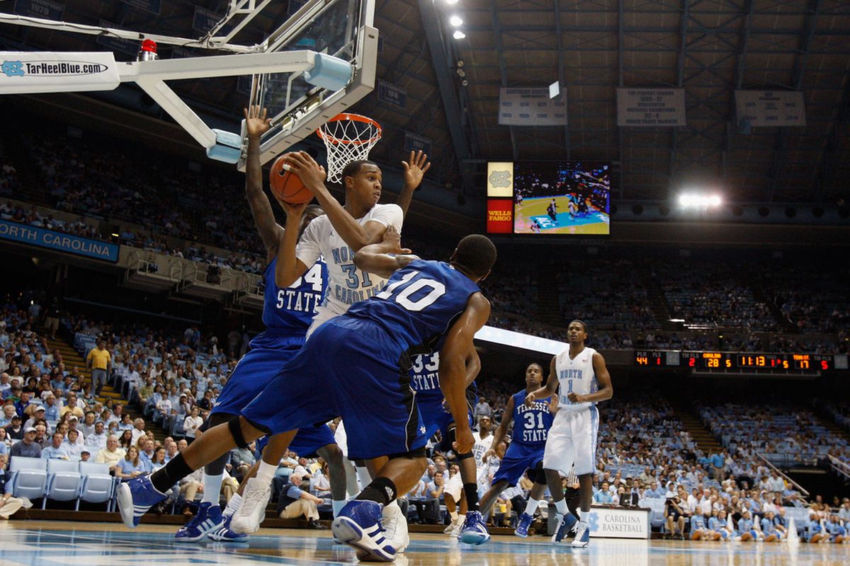 John Henson  looks to pass around Wil Peters #10 of the Tennessee State Tigers during their game at Dean Smith Center on November 22, 2011.