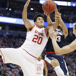 Utah Utes forward Chris Reyes (20) competes for the ball with Gonzaga Bulldogs guard Josh Perkins (13) during the NCAA basketball tournament second round in Denver,  Saturday, March 19, 2016. Gonzaga won 82-59. 