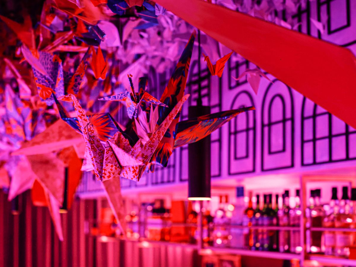 The ceiling of a Norigami’s hidden bar is decorated with origami cranes.