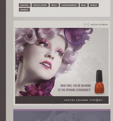 A screenshot of the official Hunger Games Tumblr blog, featuring an image of an elaborately made up Effie Trinket with the words “What will you be wearing to the opening ceremonies?” and an image of an at the time real bottle from the official Hunger Games nail polish line. 