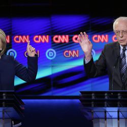Democratic presidential candidate, Hillary Clinton argues a point as Sen. Bernie Sanders, I-Vt., reacts during a Democratic presidential primary debate at the University of Michigan-Flint, Sunday, March 6, 2016, in Flint, Mich. 