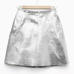 A-line metallic leather skirt, <a href="http://www.stories.com/us/Sale/All_sale/A-Line_Metallic_Leather_Skirt/590757-100589111.1">$98</a>
