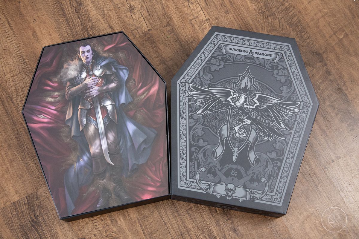 A black box with a raven on the cover opens to reveal a vampire, in full armor, lying on red satin.