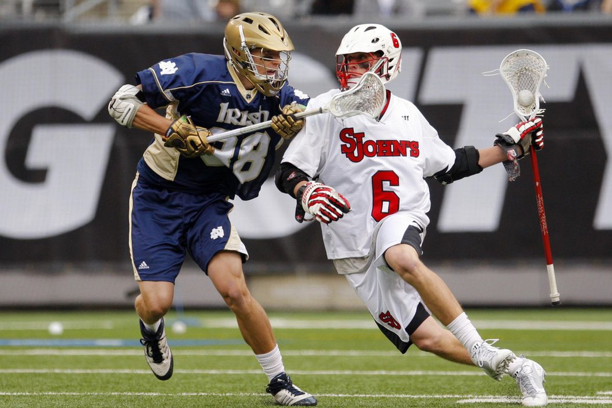 Apr 1, 2012; East Rutherford, NJ, USA;  St. Johns Red Storm attack Kieran McArdle (6) works against Notre Dame Fighting Irish midfield Jack Near (38) at the Big City Classic at MetLife Stadium. Mandatory Credit: Jim O'Connor-US PRESSWIRE