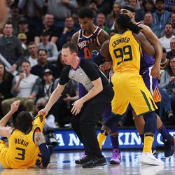 Utah Jazz guard Ricky Rubio (3) gets knocked to the ground by Phoenix Suns forward Marquese Chriss (0) and Phoenix Suns forward Jared Dudley (3)  in Salt Lake City on Thursday, March 15, 2018. The Jazz 116-88. Chriss and Dudley were both ejected.