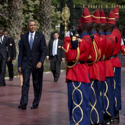 U.S. President Barack Obama is welcomed by a Senegalese honor guard as he arrives at the presidential palace in Dakar, Senegal, Thursday, June 27, 2013. President Obama landed in Senegal Wednesday night to kick off a weeklong trip to Africa, a three-country visit aimed at overcoming disappointment on the continent over the first black U.S. president's lack of personal engagement during his first term. 