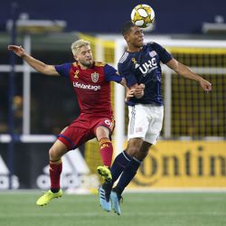 New England Revolution midfielder Brandon Bye, right, heads the ball as Real Salt Lake midfielder Kelyn Rowe (6) defends during the second half of an MLS soccer match at Gillette Stadium, Saturday, Sept. 21, 2019, in Foxborough, Mass.