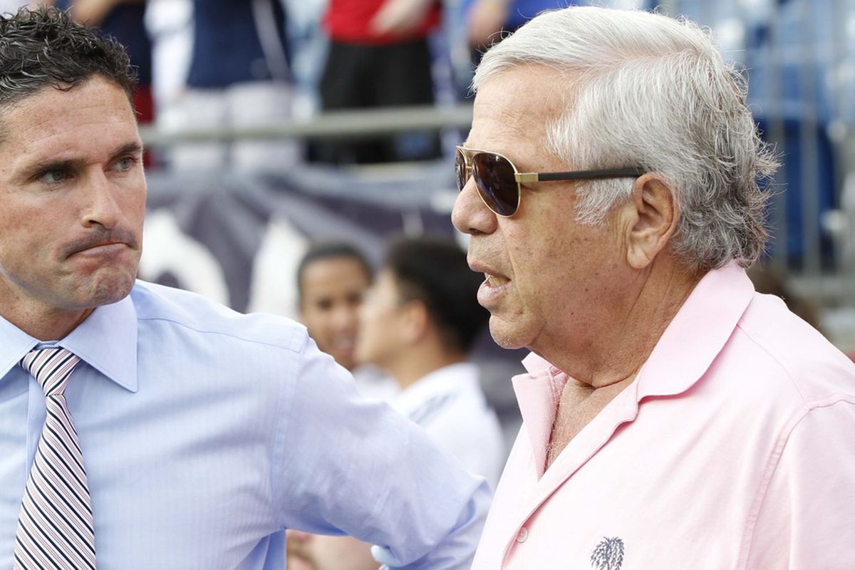 July 8, 2012; Foxboro, Massachusetts, USA; The New England Revolution head coach Jay Heaps talks with Robert Kraft during the first half against the New York Red Bulls at Gillette Stadium.  Mandatory Credit: Greg M. Cooper-US PRESSWIRE